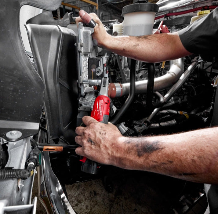 Milwaukee M12 Fuel 3/8" High Speed Ratchet tool in use on vehicle engine tools.