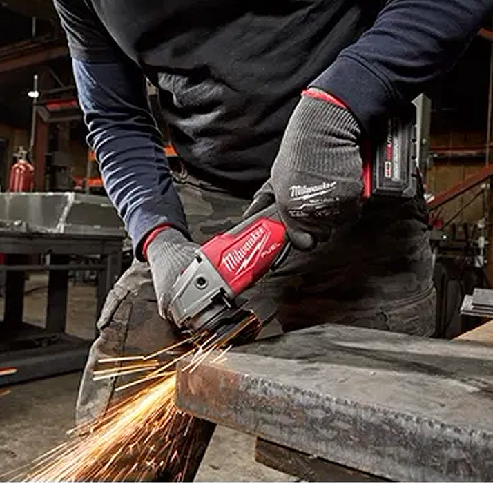 Milwaukee M18 Fuel Grinder 2880-20 cutting metal with sparks, handheld power tool in use.