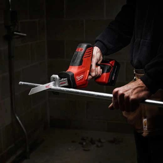 Milwaukee M18 Hackzall 2625-20 red cordless tool cutting metal pipe.